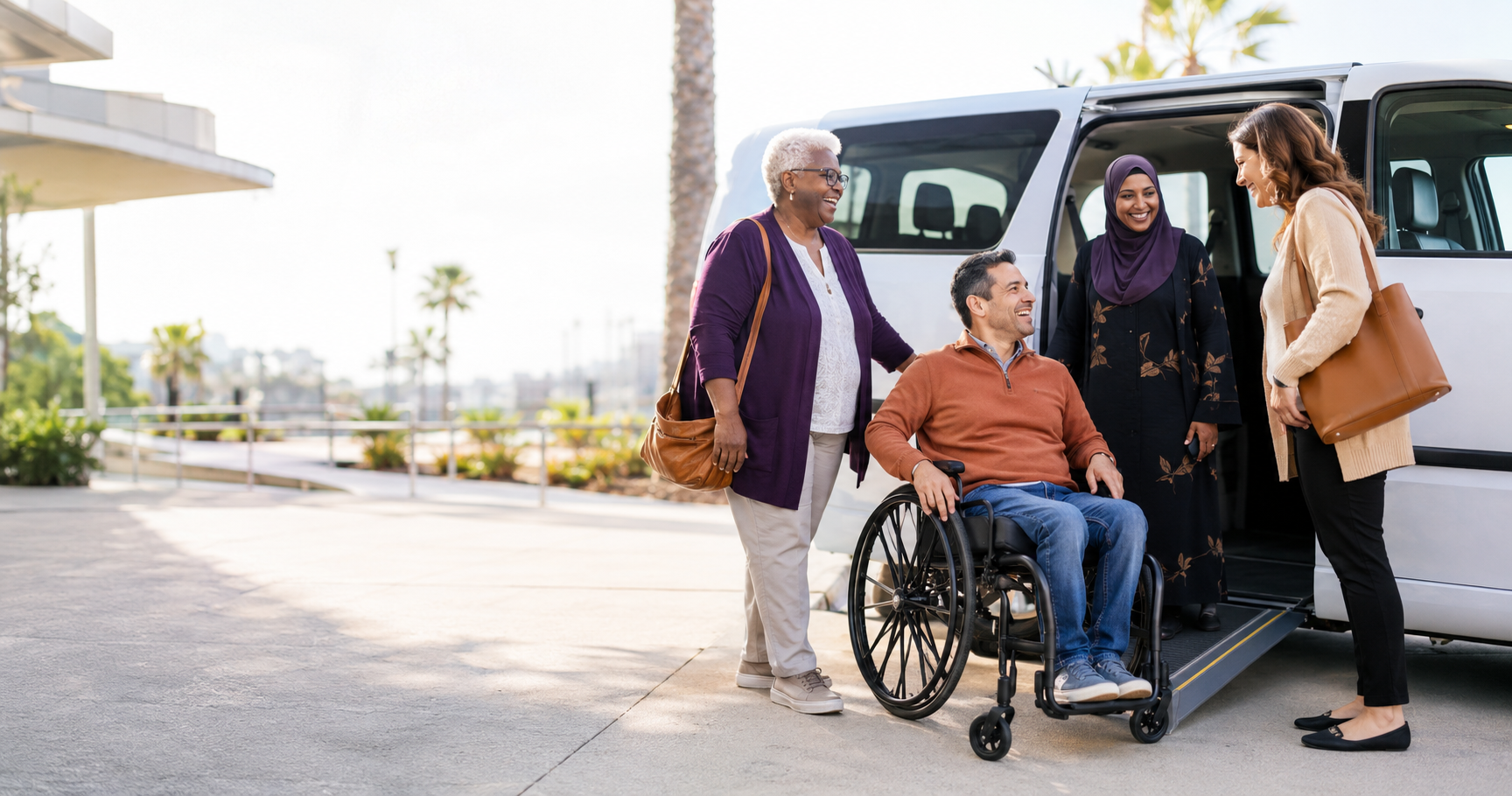 Diverse San Diego residents and a mobility coordinator beside an accessible vehicle